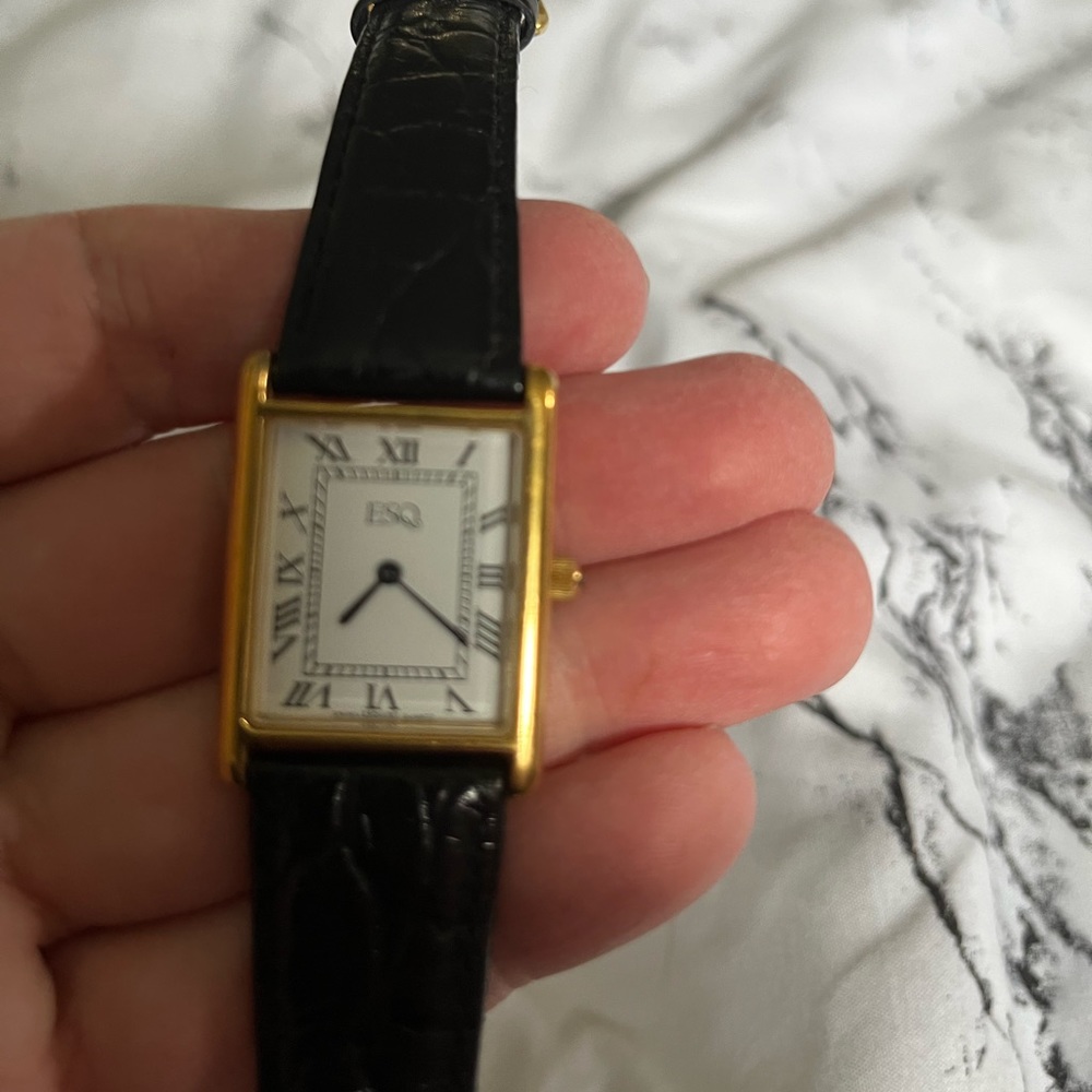 Men’s ESQ tank watch.
